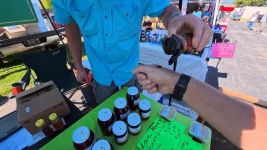 10-pouring-honey-sample-on-hand.webp